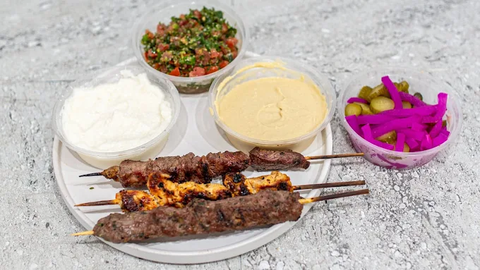 Mixed skewer plate with hummus, tabbouleh and pickles